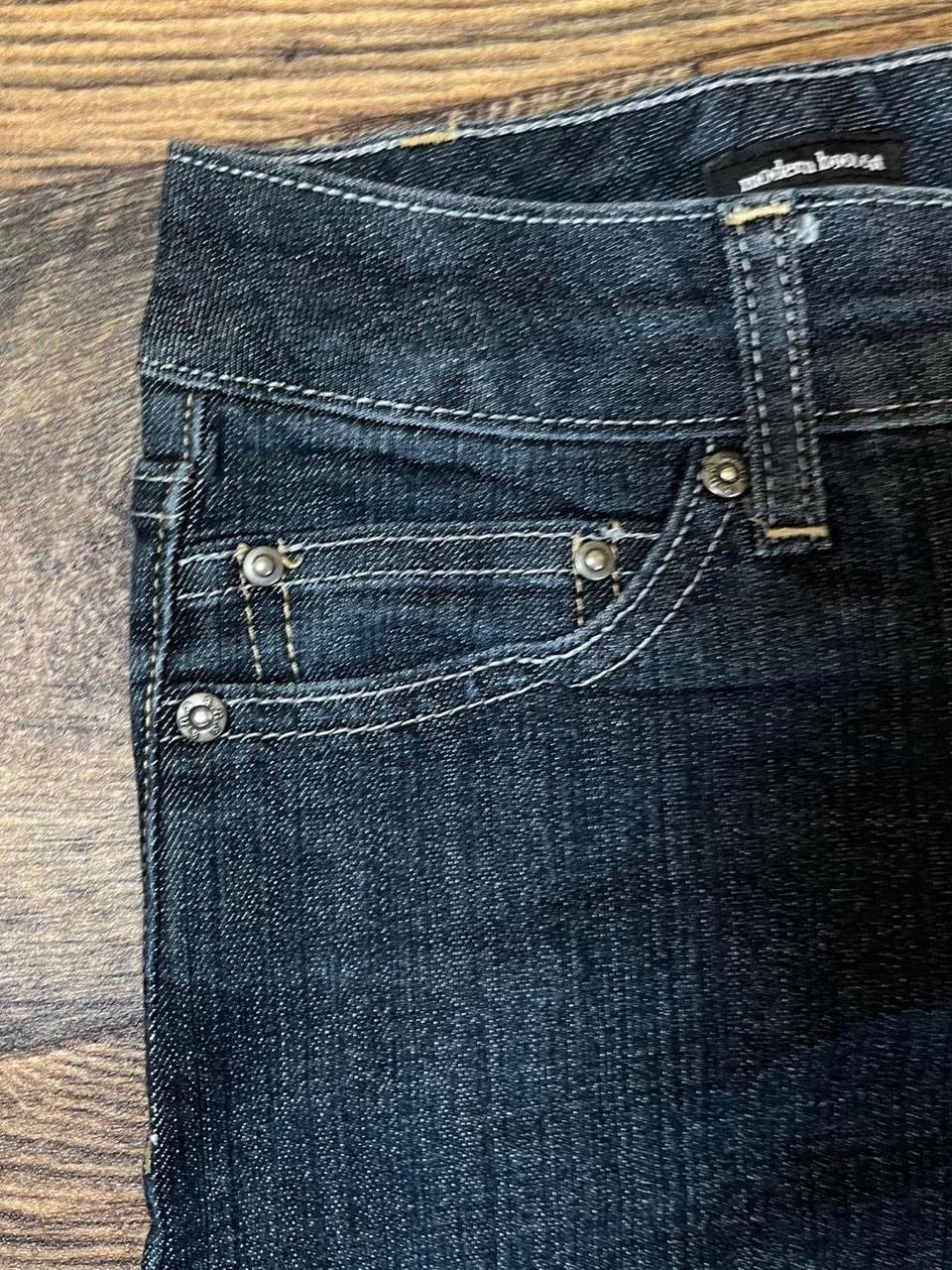 Low rise bootcut jeans with studded pockets