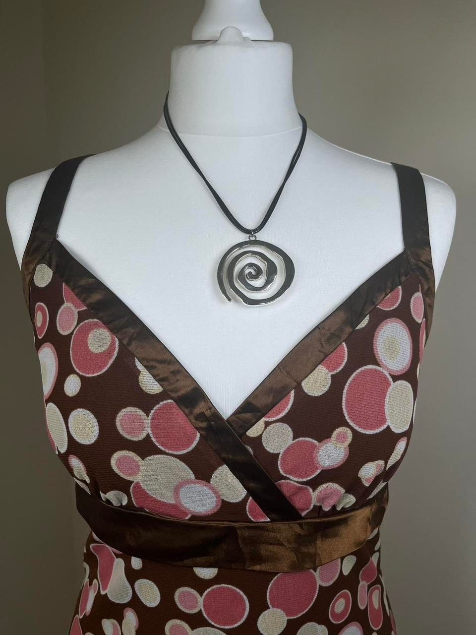 Polka dot cami top with ruffled trim
