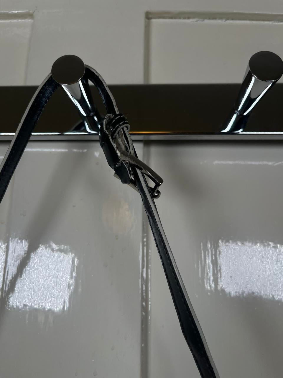 Leather shoulder bag with white stitching